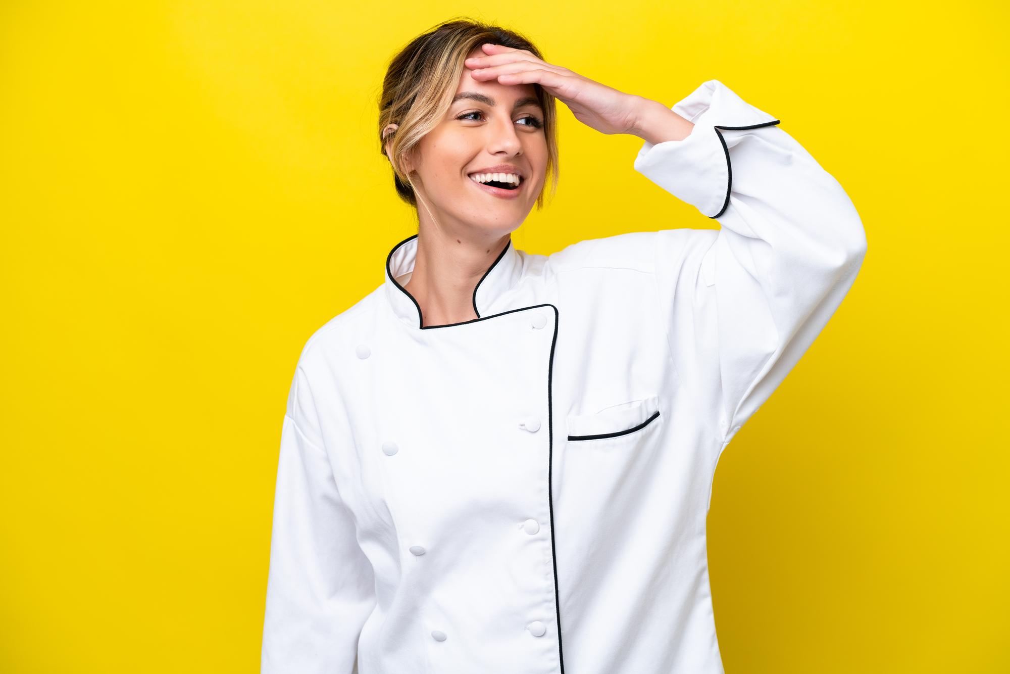 Friendly chef in a bright kitchen smiling at camera